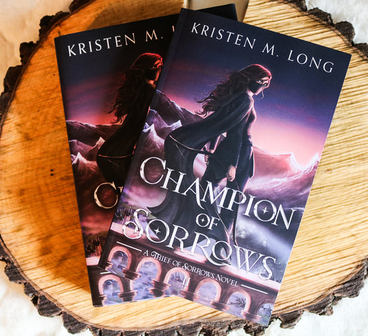 SIGNED Champion of Sorrows Paperback